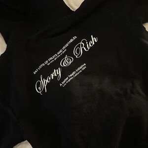 Sporty & Rich Black Hoodie with White Script Logo